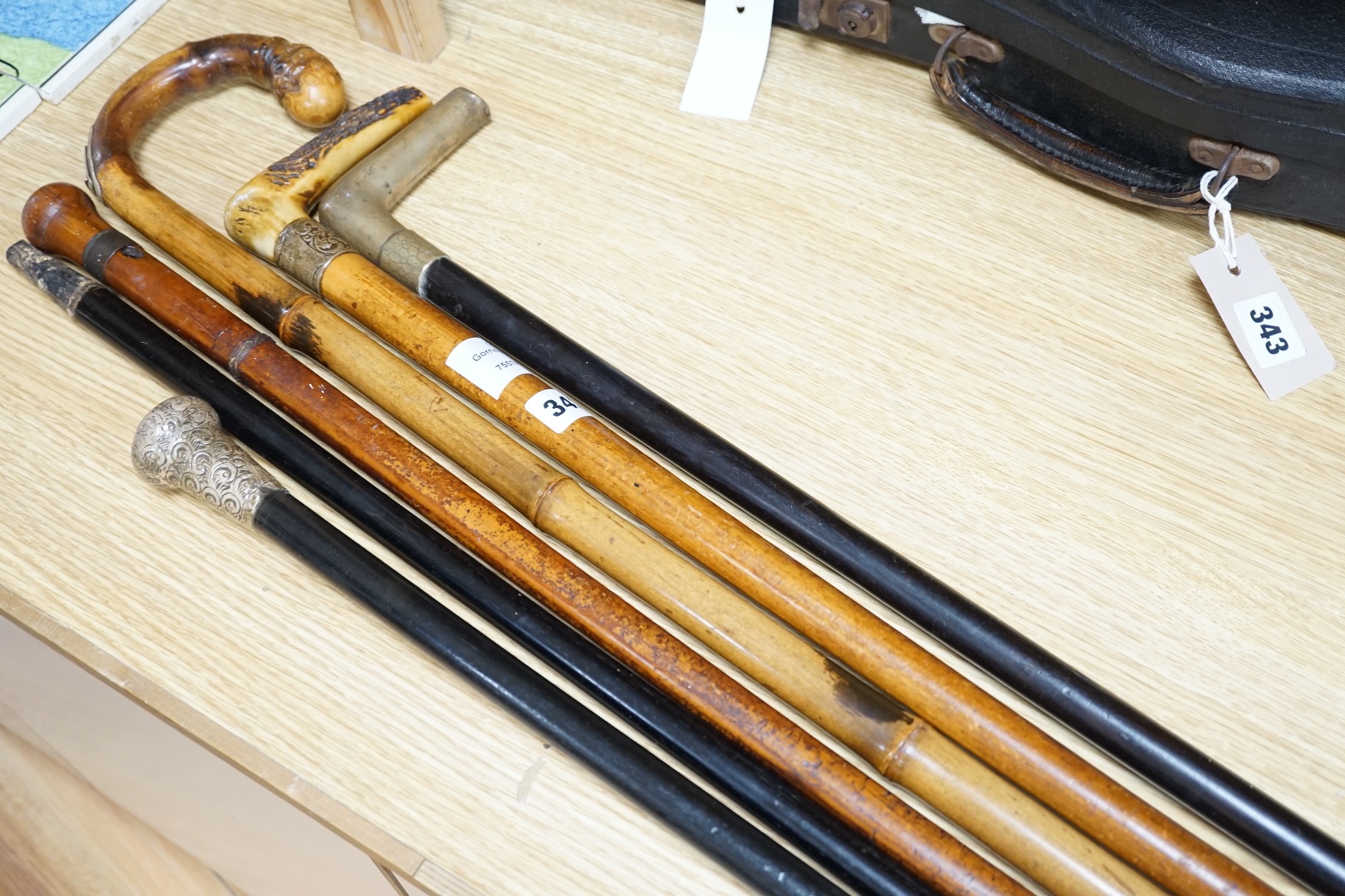 Two Victorian silver mounted walking sticks, a sword stick and three other sticks (6)